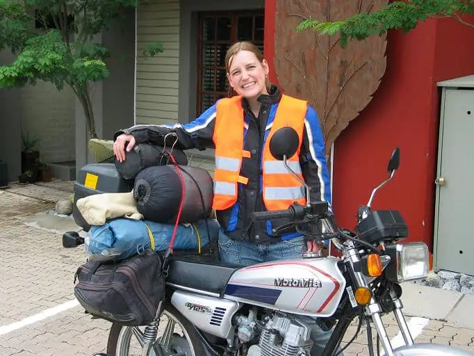 Small bike heavily laden with camping gear