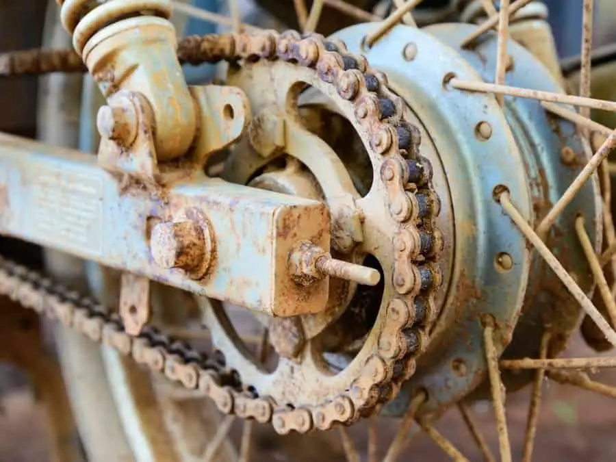 Rusty and dirty motorcycle chain in need of replacing