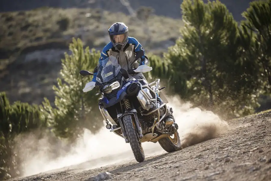 Rider standing up to control the bike in the dirt