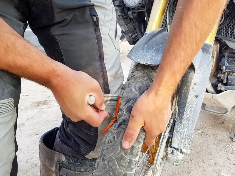 Fixing a tire with a repair kit