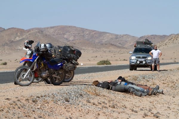 Resting next to the road on an adventure bike trip